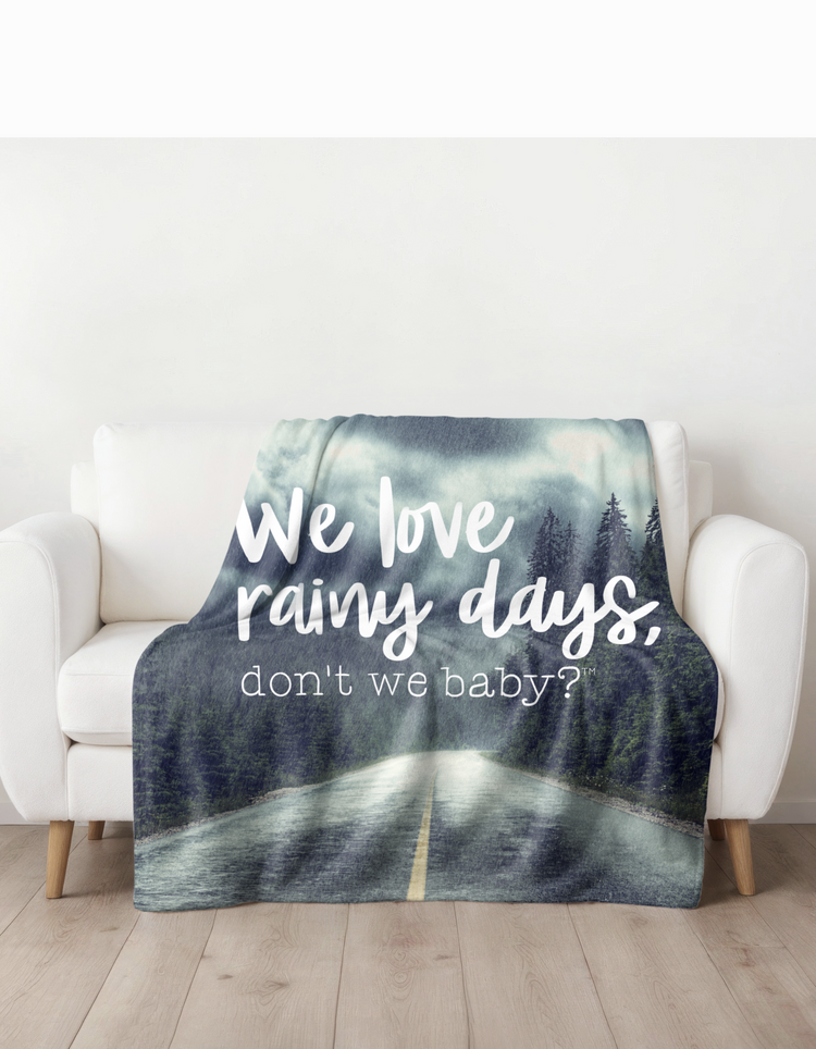 We love rainy days, don’t we baby?® Fleece Blanket