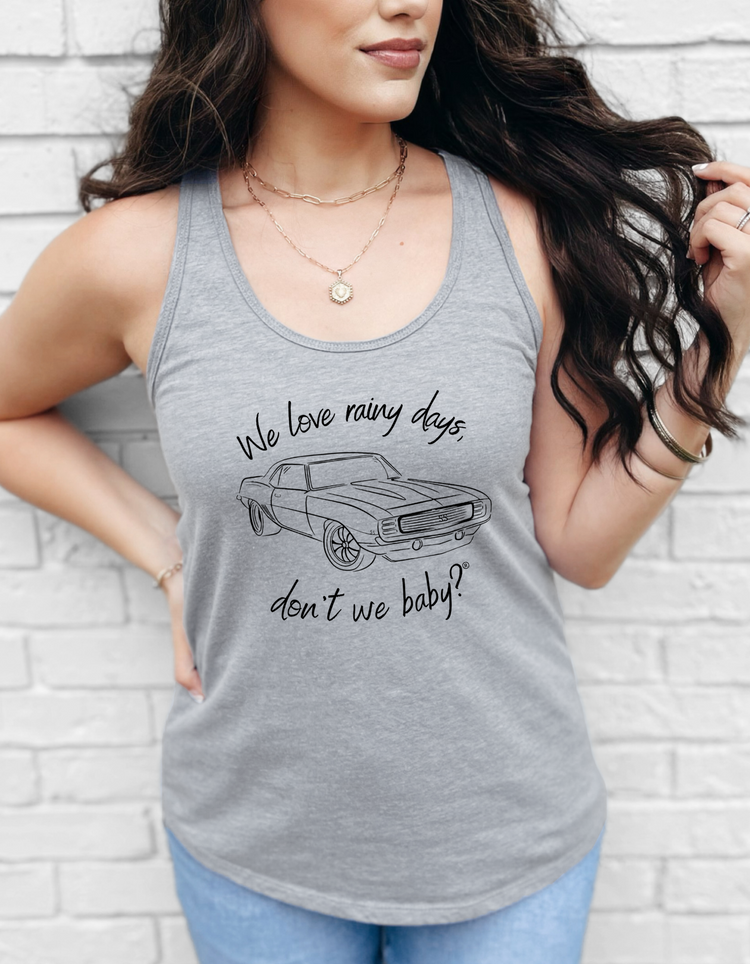 We love rainy days, don’t we baby?® Racerback Tank