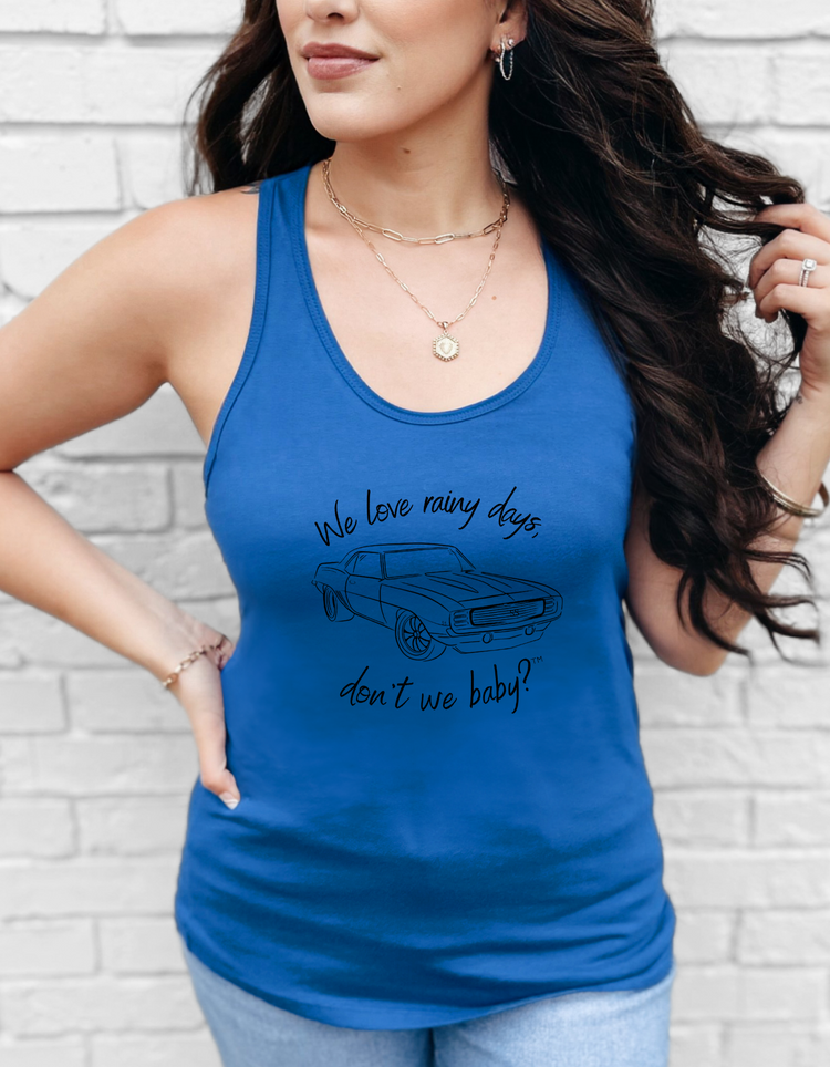 We love rainy days, don’t we baby?™ Racerback Tank