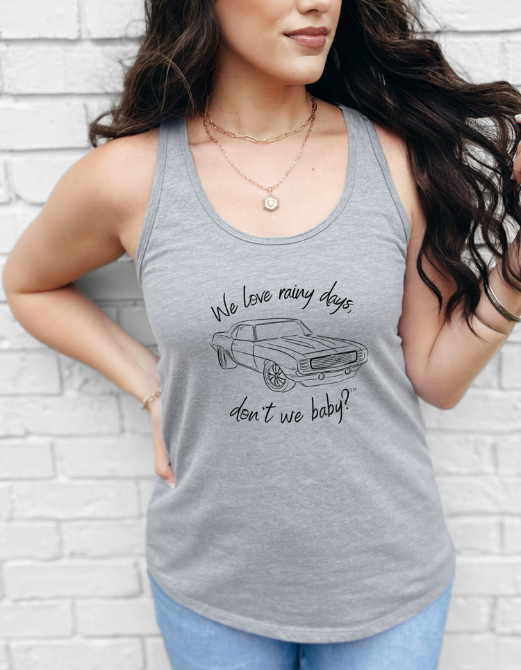 We love rainy days, don’t we baby?™ Racerback Tank