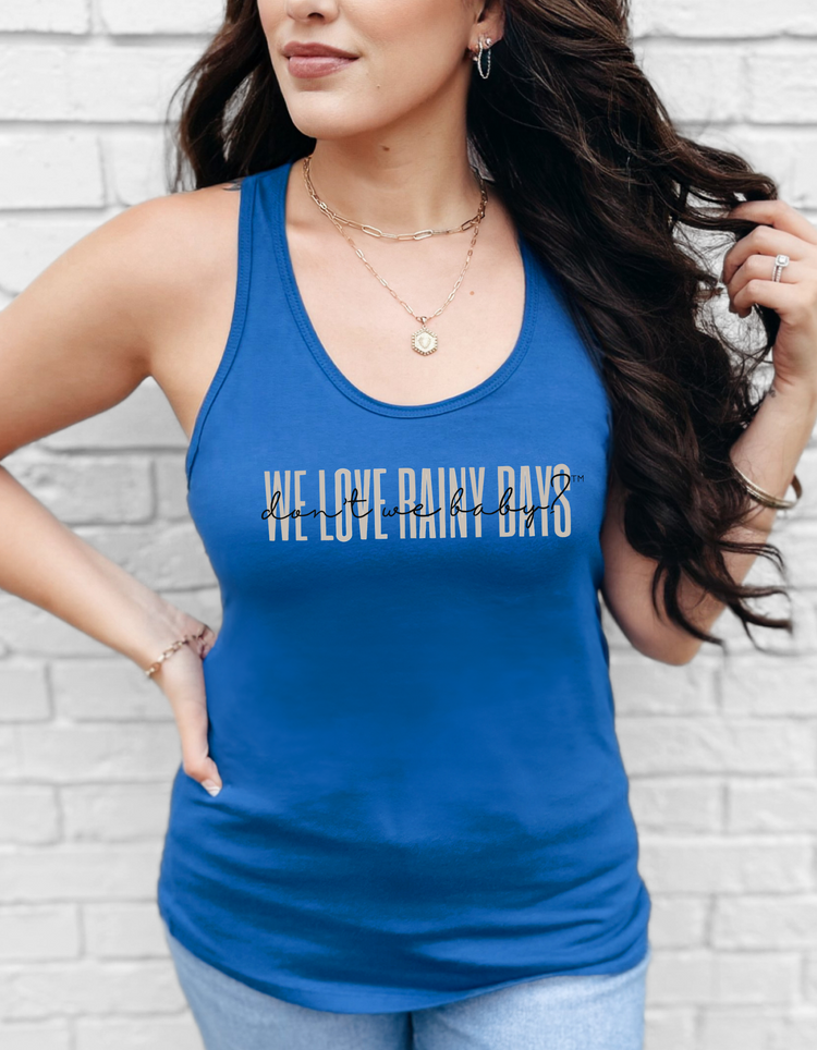 We love rainy days, don’t we baby?™ Racerback Tank